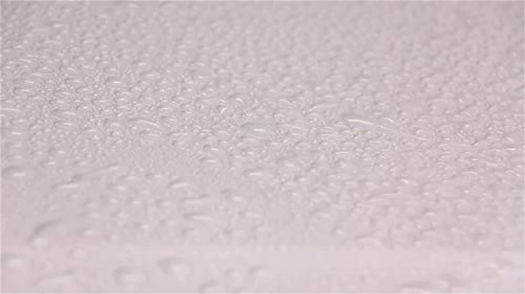 Light gray foamy wax texture with small raised bubbles