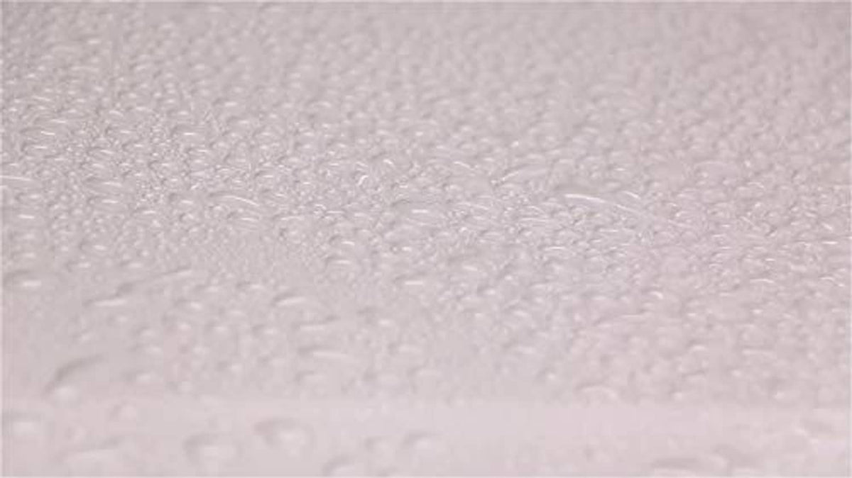 Light gray foamy wax texture with small raised bubbles
