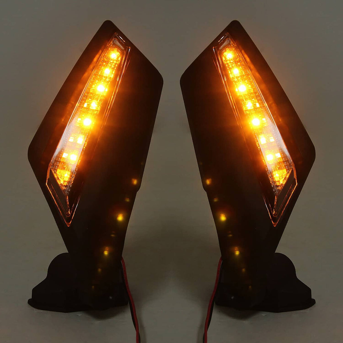 Two black UTV rearview mirrors illuminated with amber LED strips