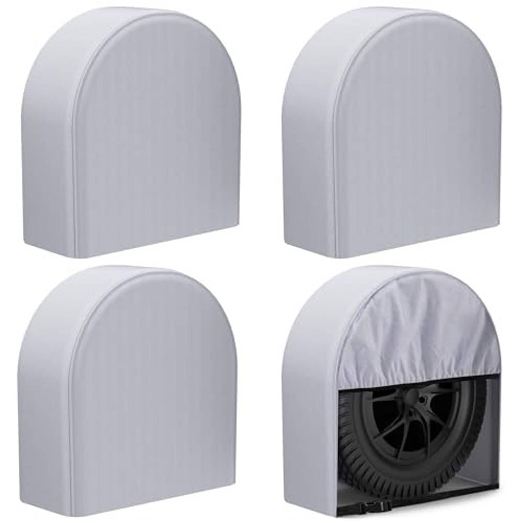 4-pack light gray RV tire wheel covers, arched fronts; one tire covered