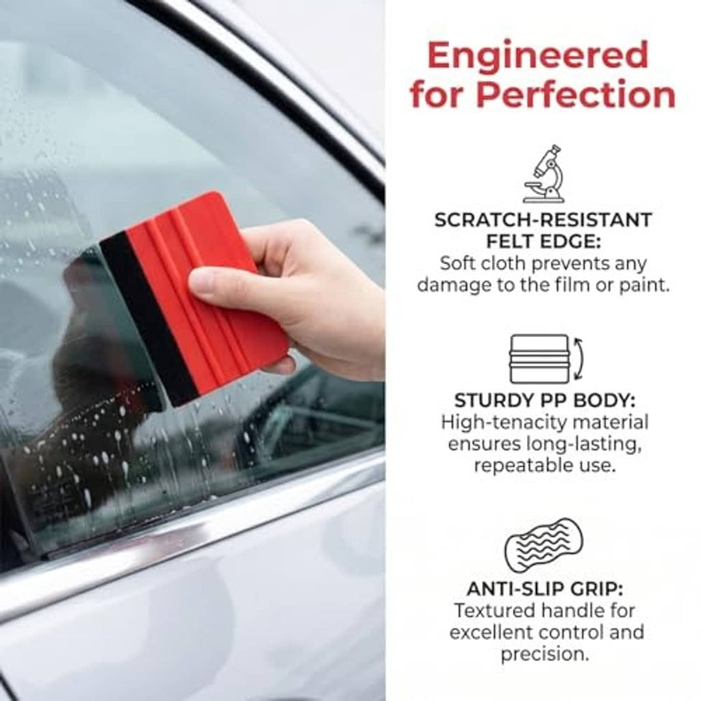 Red plastic felt-edge squeegee in hand, for smooth window or film application