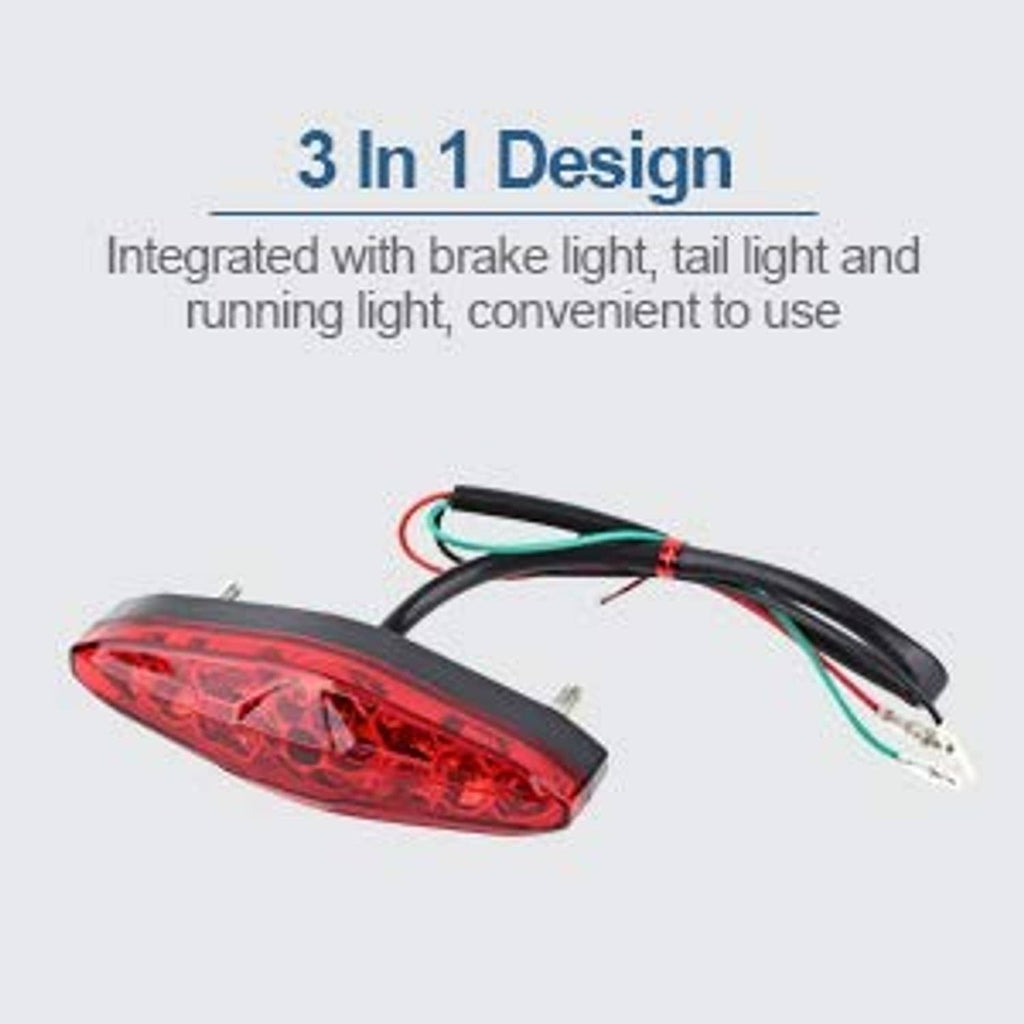 Red LED motorcycle rear tail light with black housing and wiring harness