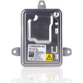 HID headlight ballast unit with metal housing, mounting brackets, and yellow warning label
