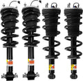 Set of four black shock absorber struts with coil springs and mounting brackets