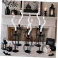 Set of twisting white ghost candles with black bases and black tulle ribbon bows