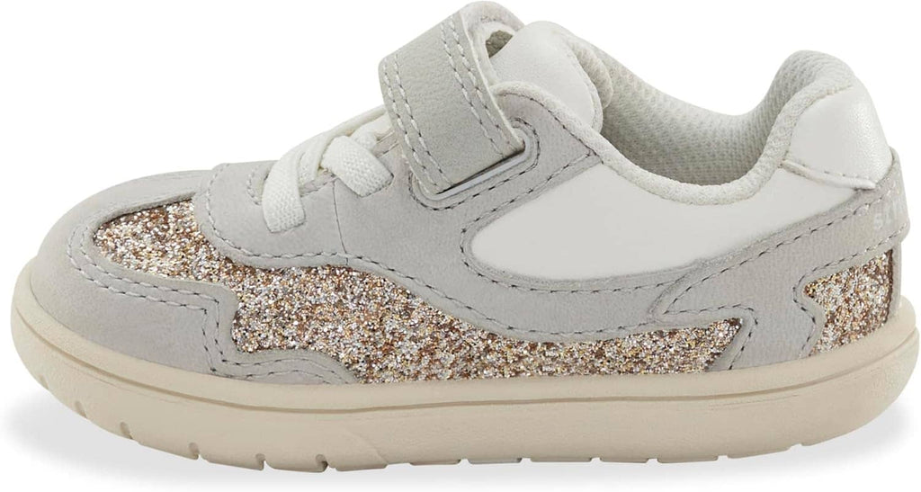 Kids light gray sneaker with Velcro strap, glitter side panel, and cushioned collar