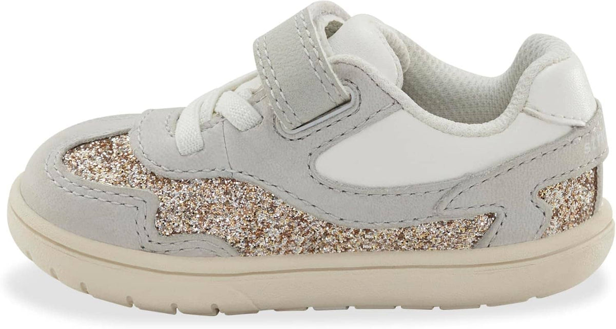 Kids light gray sneaker with Velcro strap, glitter side panel, and cushioned collar