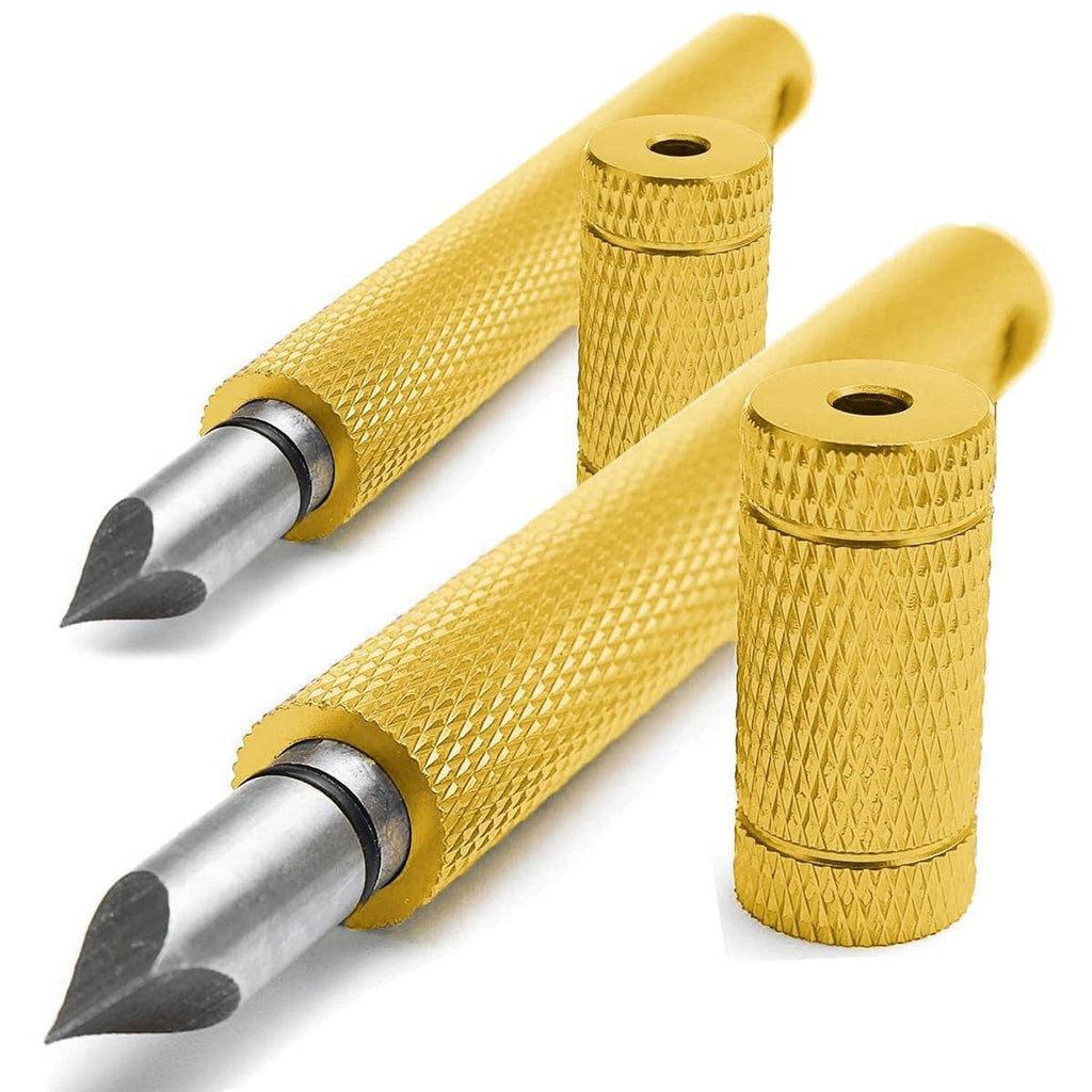 Two gold golf groove sharpeners with textured handles and angled metal tips