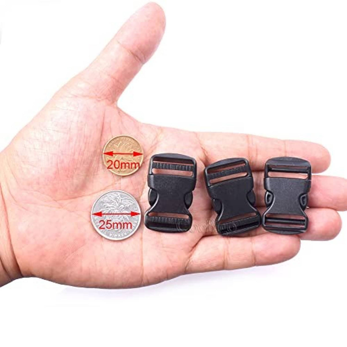 Small set of dark gray dual adjustable side-release buckles, shown in hand