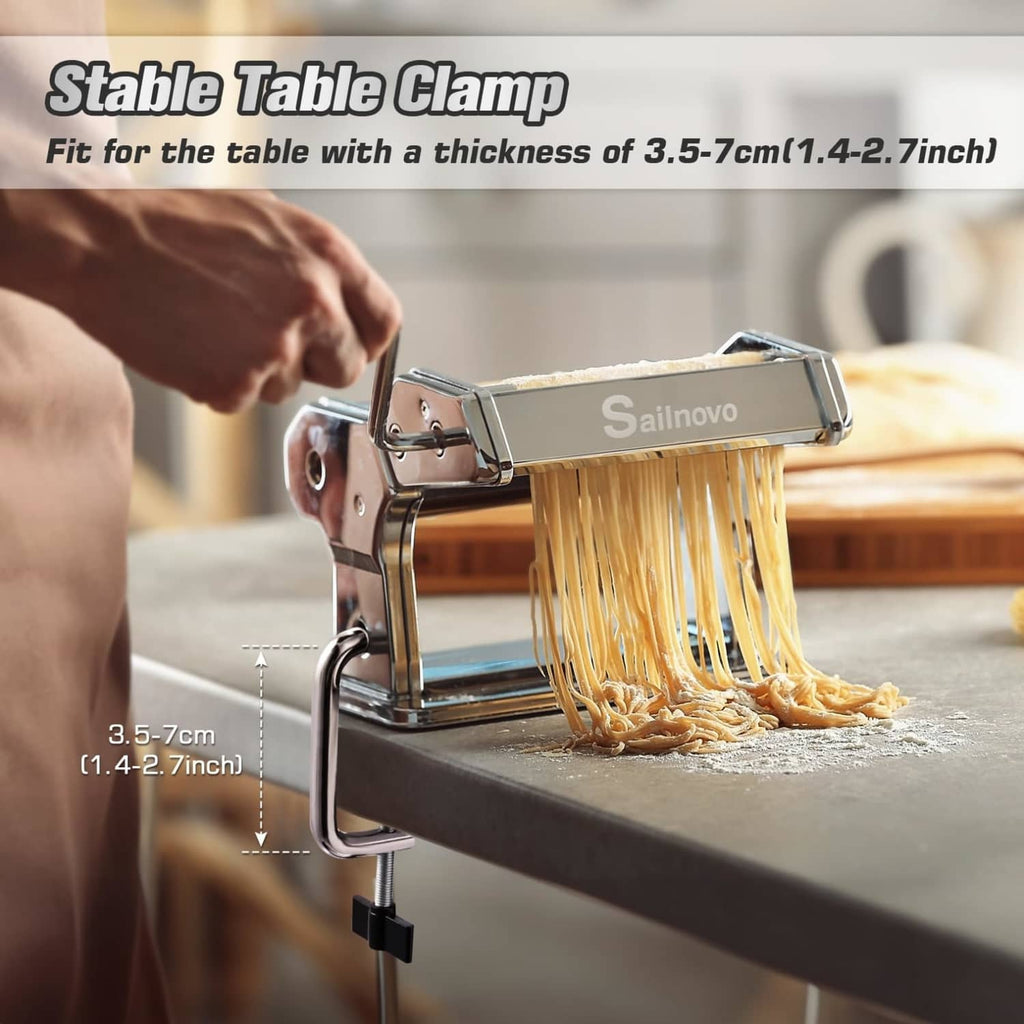 Manual pasta maker with table clamp and roller bed, extruding thin pasta strands