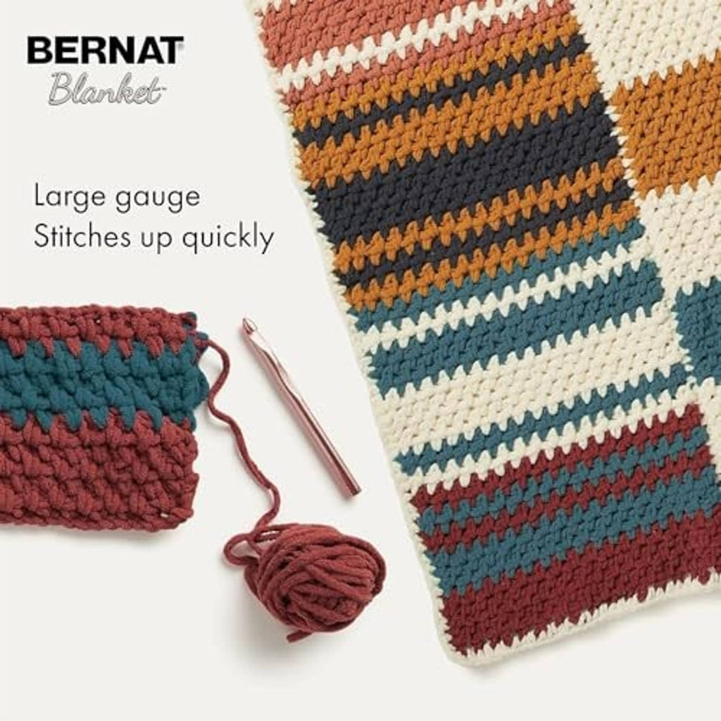 Striped crochet swatch with yarn balls and crochet hook for quick stitching