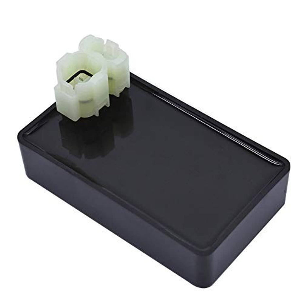 Black ignition control box with white multi-pin plug, angled view
