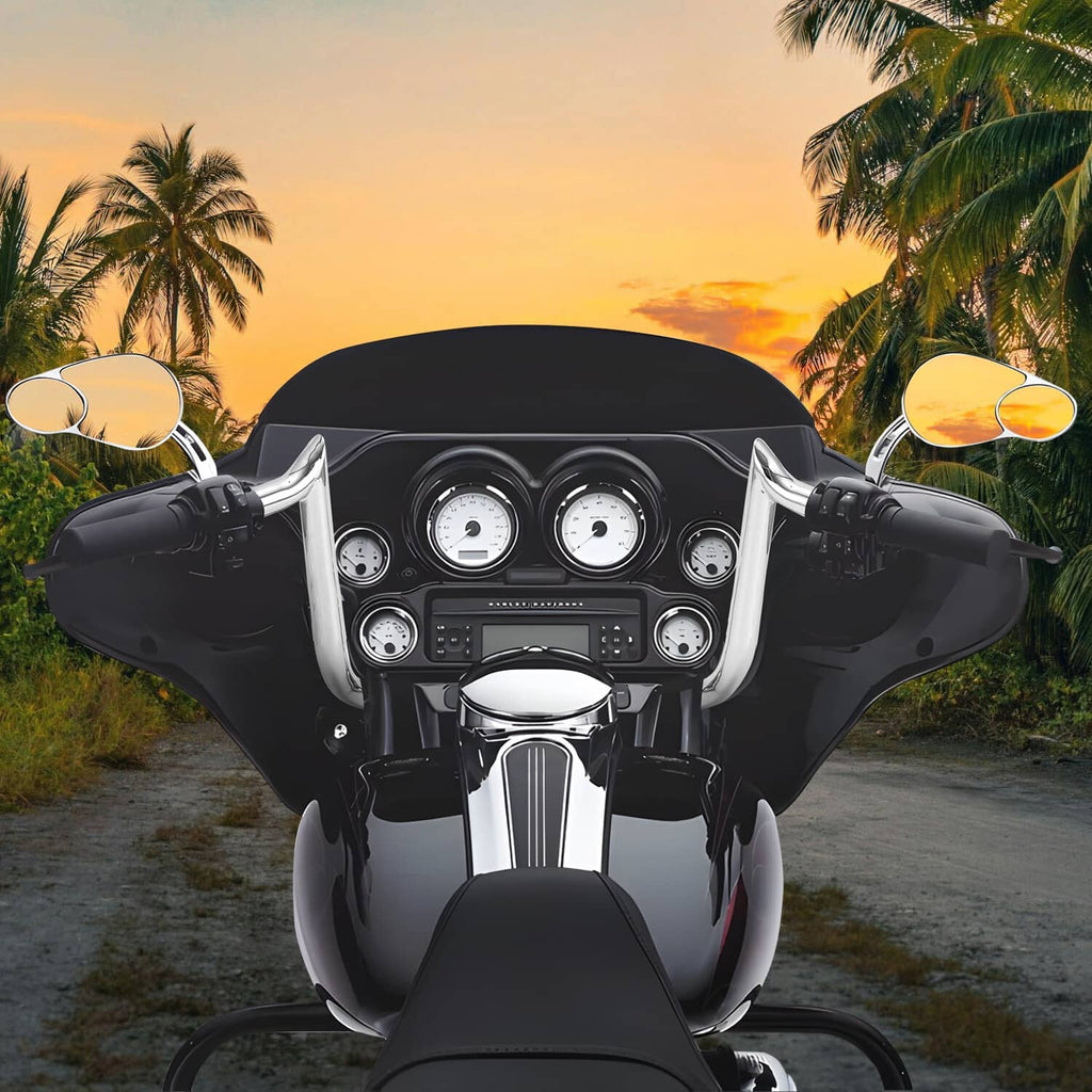 Chrome ape hanger handlebars mounted on a motorcycle with gauges and controls