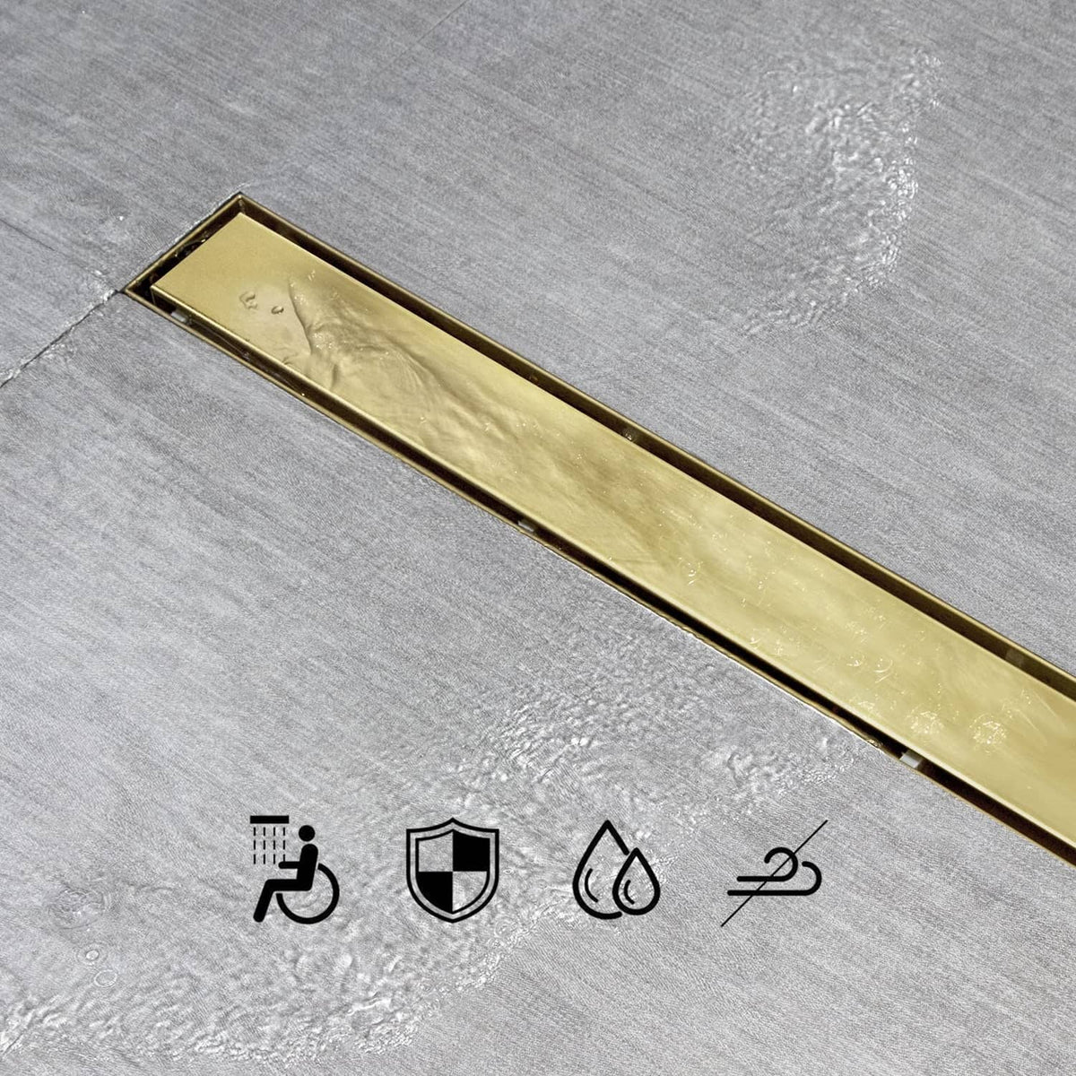 Gold linear shower drain tile insert grate viewed from above on tile