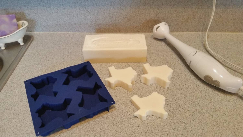 Silicone Texas baking mold on countertop with light-colored baked pieces