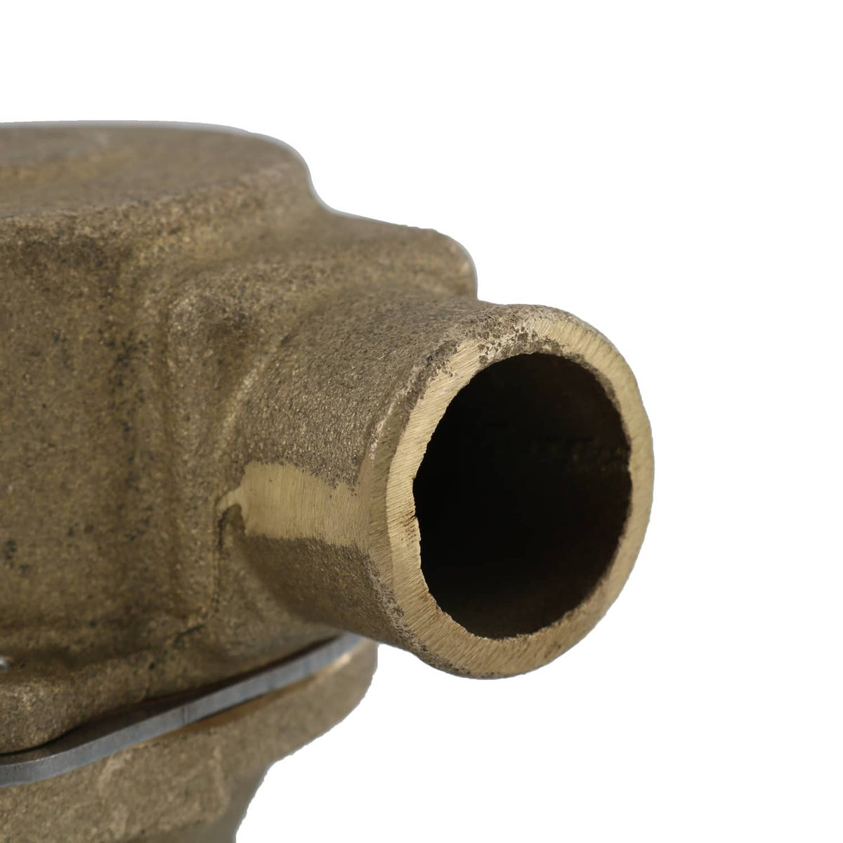 Raw water pump close-up of round inlet opening on brass-colored body