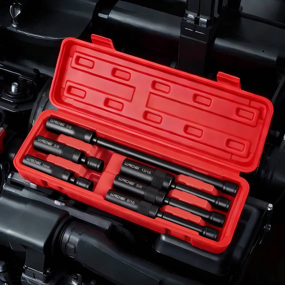Red tool case holding six black spark plug sockets with 3/8-inch drive