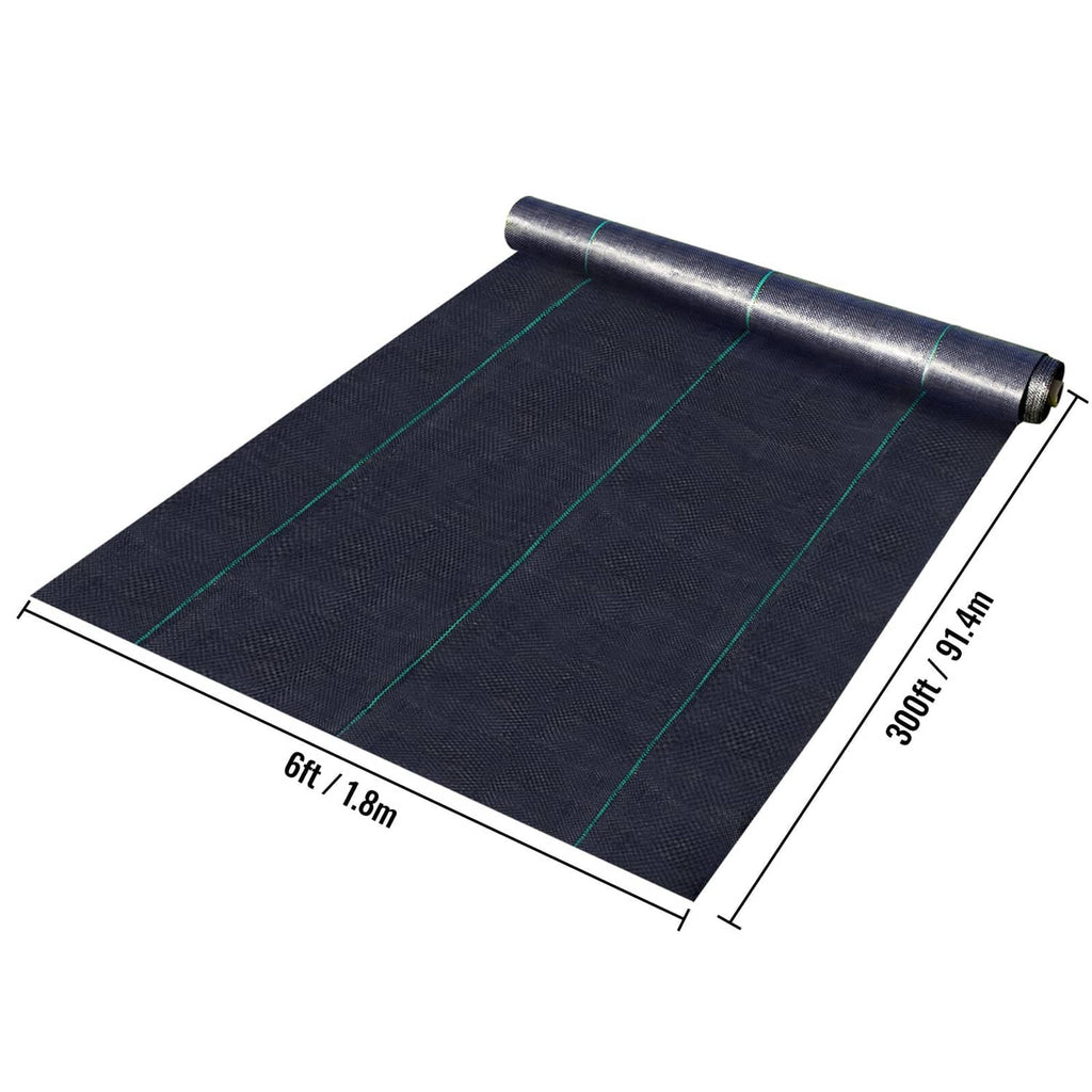 Folded black weed barrier fabric sheet with green guide lines and rolled end