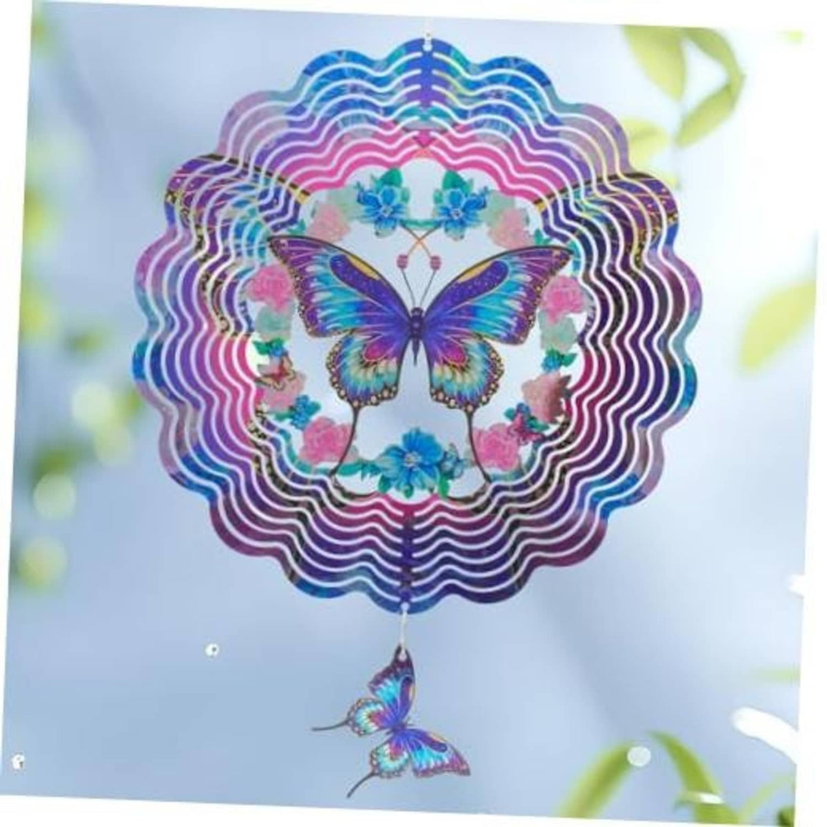 Hanging butterfly wind spinner with blue and purple center butterfly and scalloped spiral rings