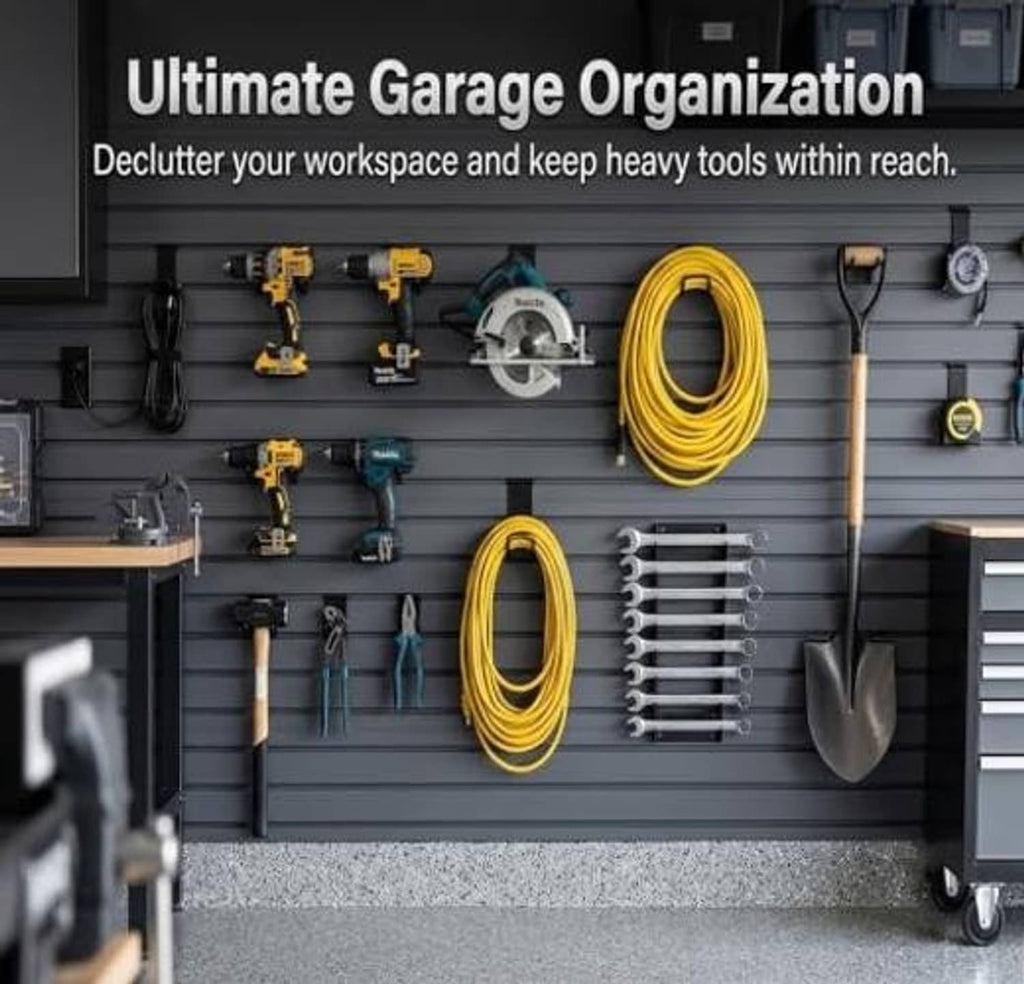 Black slatwall hooks on a garage organizer panel holding hanging tools and accessories