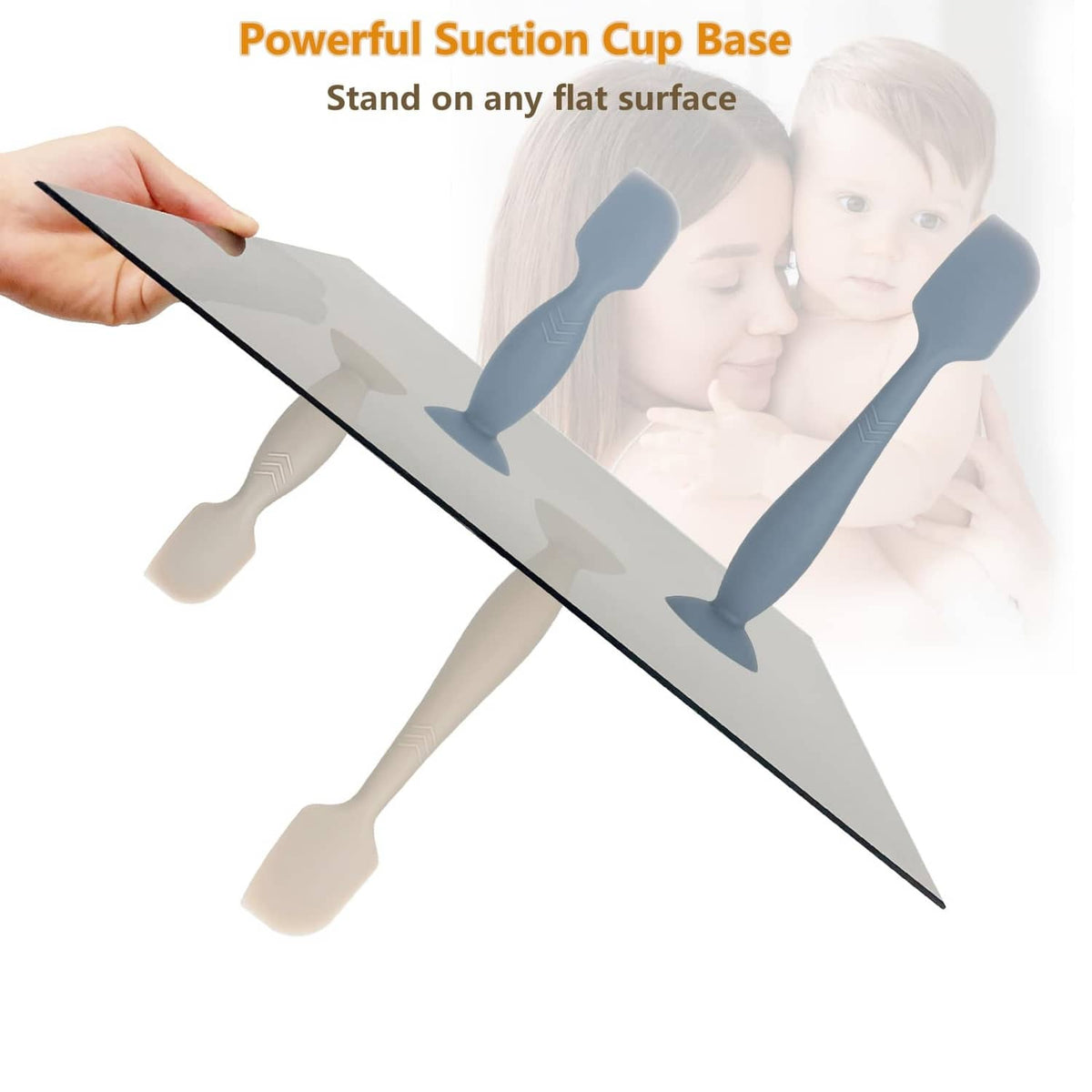 Dark blue diaper cream spatula applicator with suction cup base, shown standing