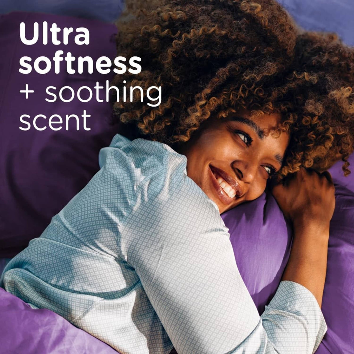 Person resting on purple bedding with a soft, cozy look
