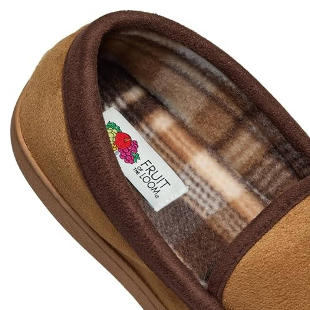Close-up of tan slipper interior lining with woven label on footbed