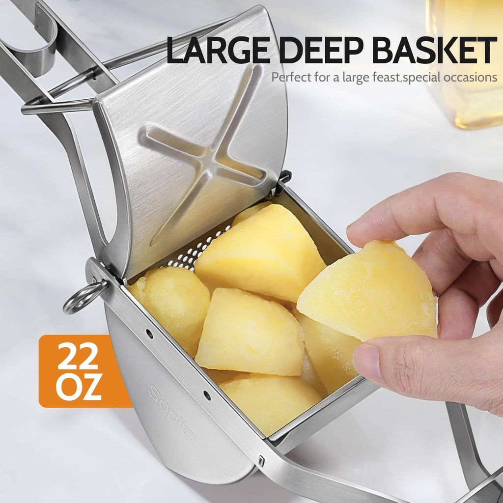 Stainless steel potato ricer basket holding potatoes, hand gripping the handle