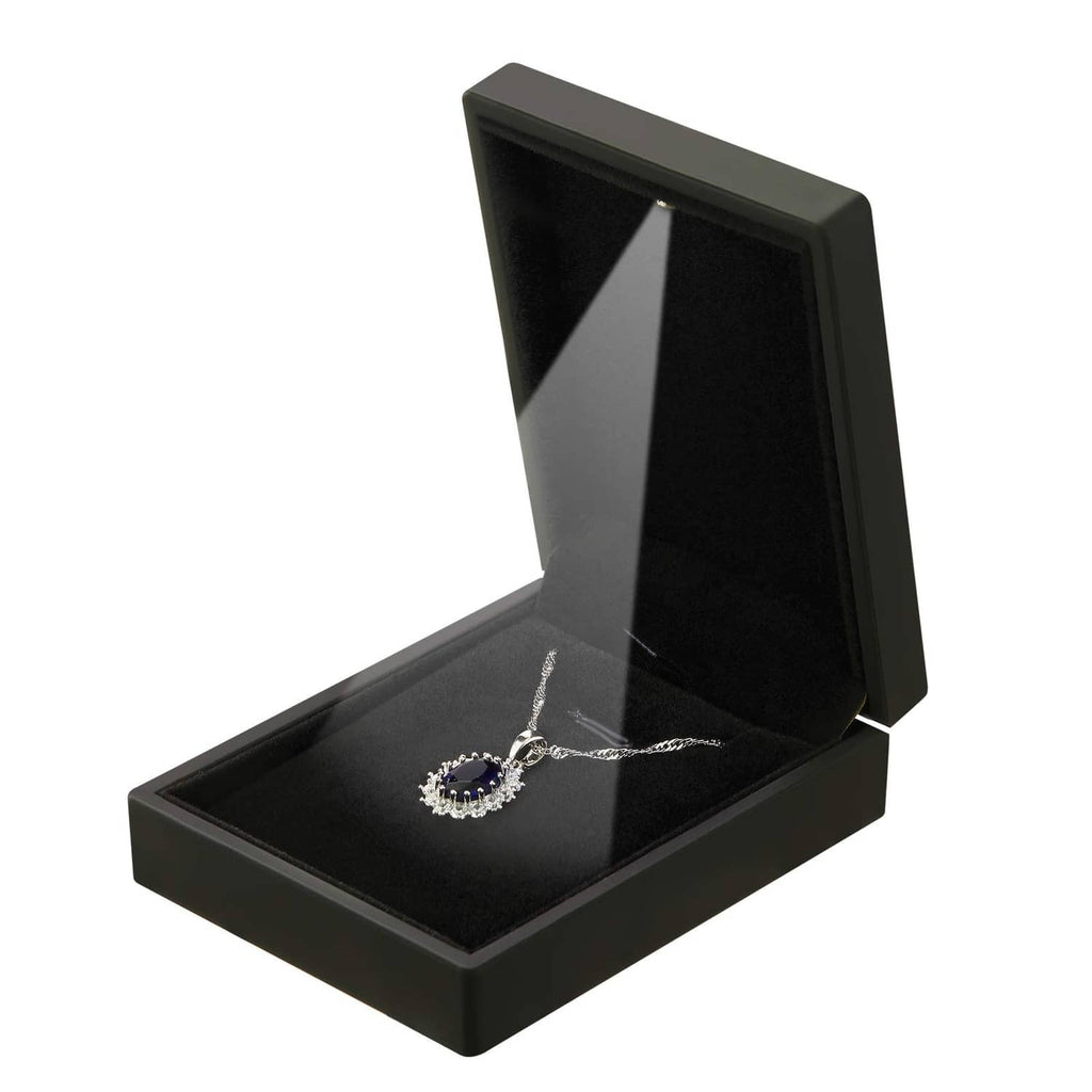 Black velvet jewelry gift box with open lid and necklace on velvet insert