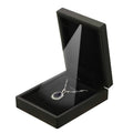 Black velvet jewelry gift box with open lid and necklace on velvet insert