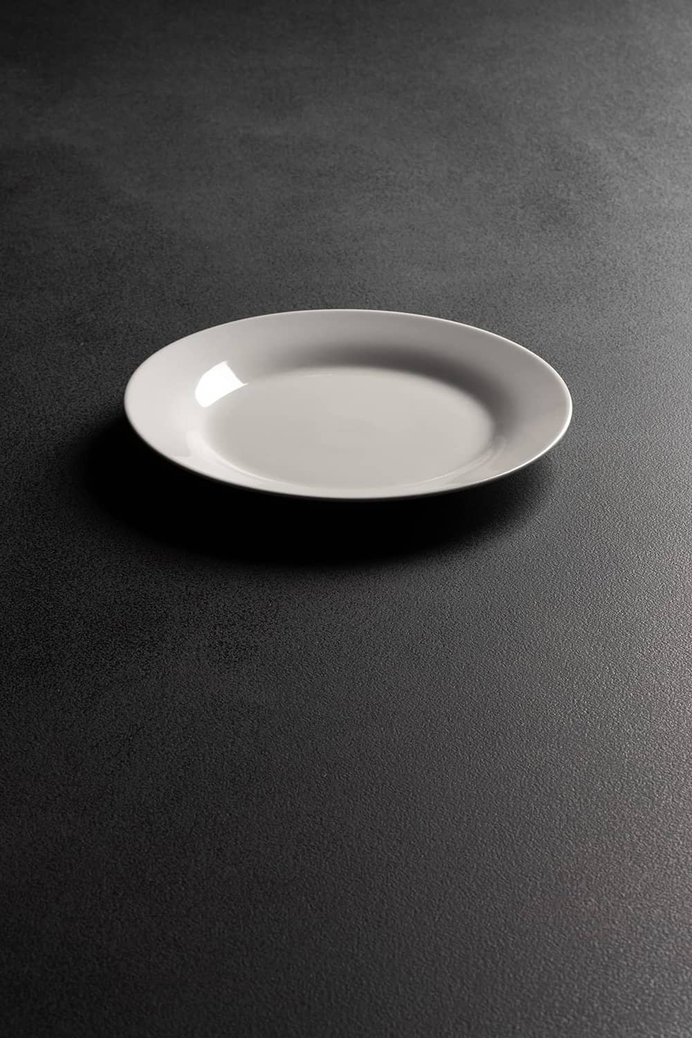 White round shallow dessert plate with smooth glossy finish
