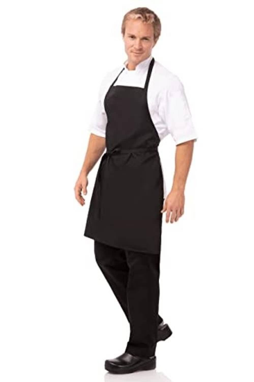 Black unisex apron with neck strap, waist ties, and front pockets; worn with pants