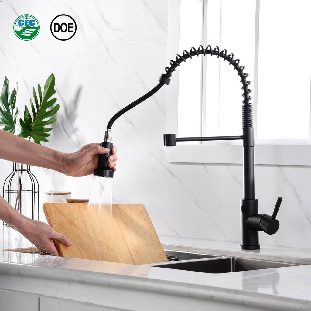 Matte black pull-down faucet sprayer head with water flow stream, used at kitchen sink