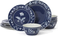 Dark blue porcelain dinnerware set with white floral crown design: plates and bowls