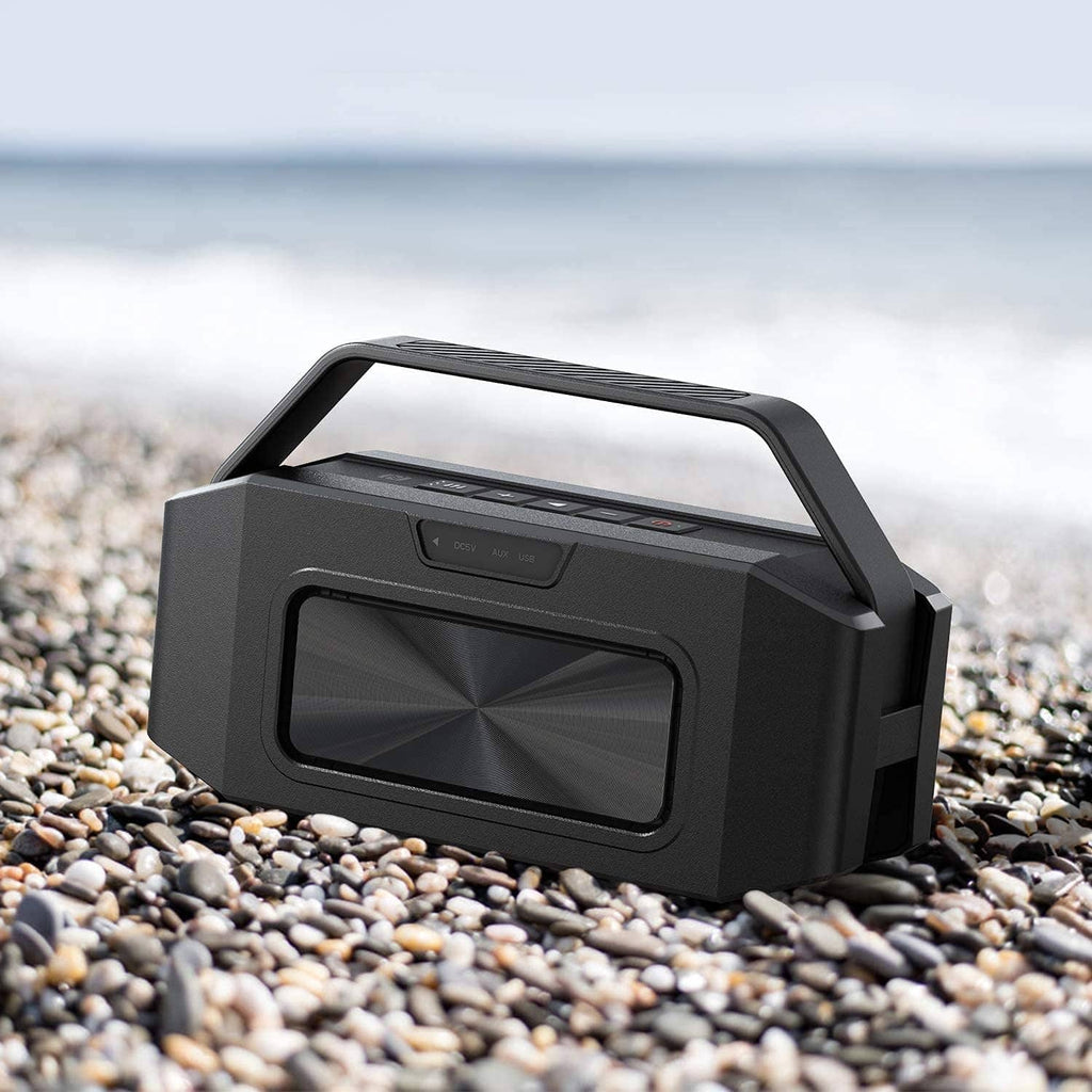 Black portable Bluetooth speaker with carry handle and front speaker grille
