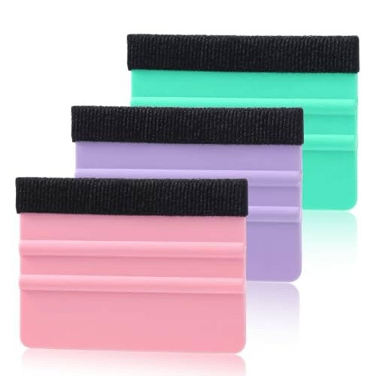 Three felt squeegee pads with black handles in pink, purple, and teal for vinyl