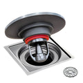 Black shower drain backflow preventer with red silicone seal and metal strainer