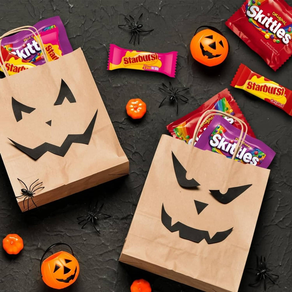Trick-or-treat kraft bags with Halloween icons, filled with Skittles candy packs