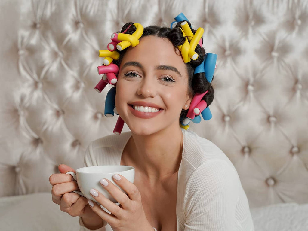 Woman wearing multi-color heatless hair rods in her hair