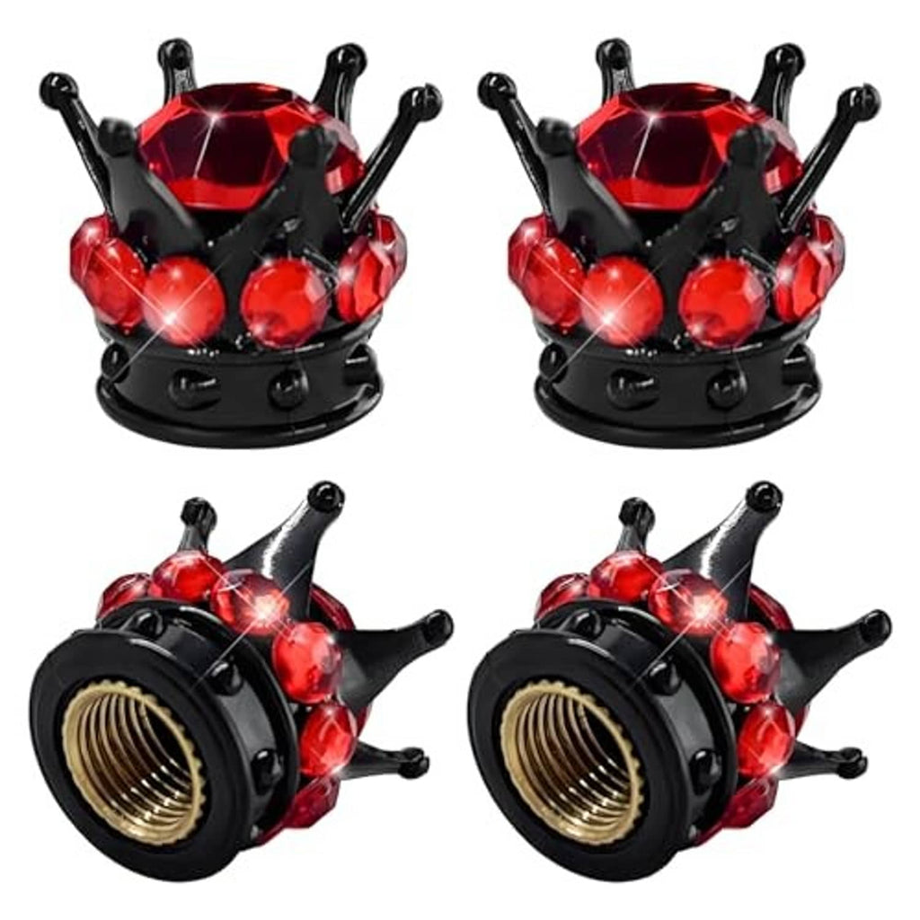 Black tire valve stem caps with red faceted crown tops and glowing gem accents