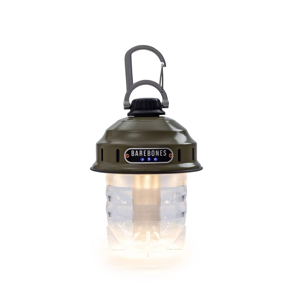 Olive drab vintage LED camping lantern with handle, glowing warm light, clear diffuser