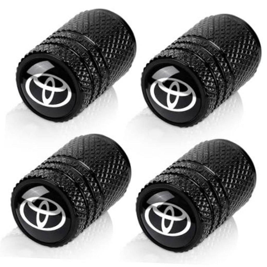 Set of four black textured tire valve stem caps with Toyota emblem, threaded end exposed