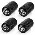 Set of four black textured tire valve stem caps with Toyota emblem, threaded end exposed