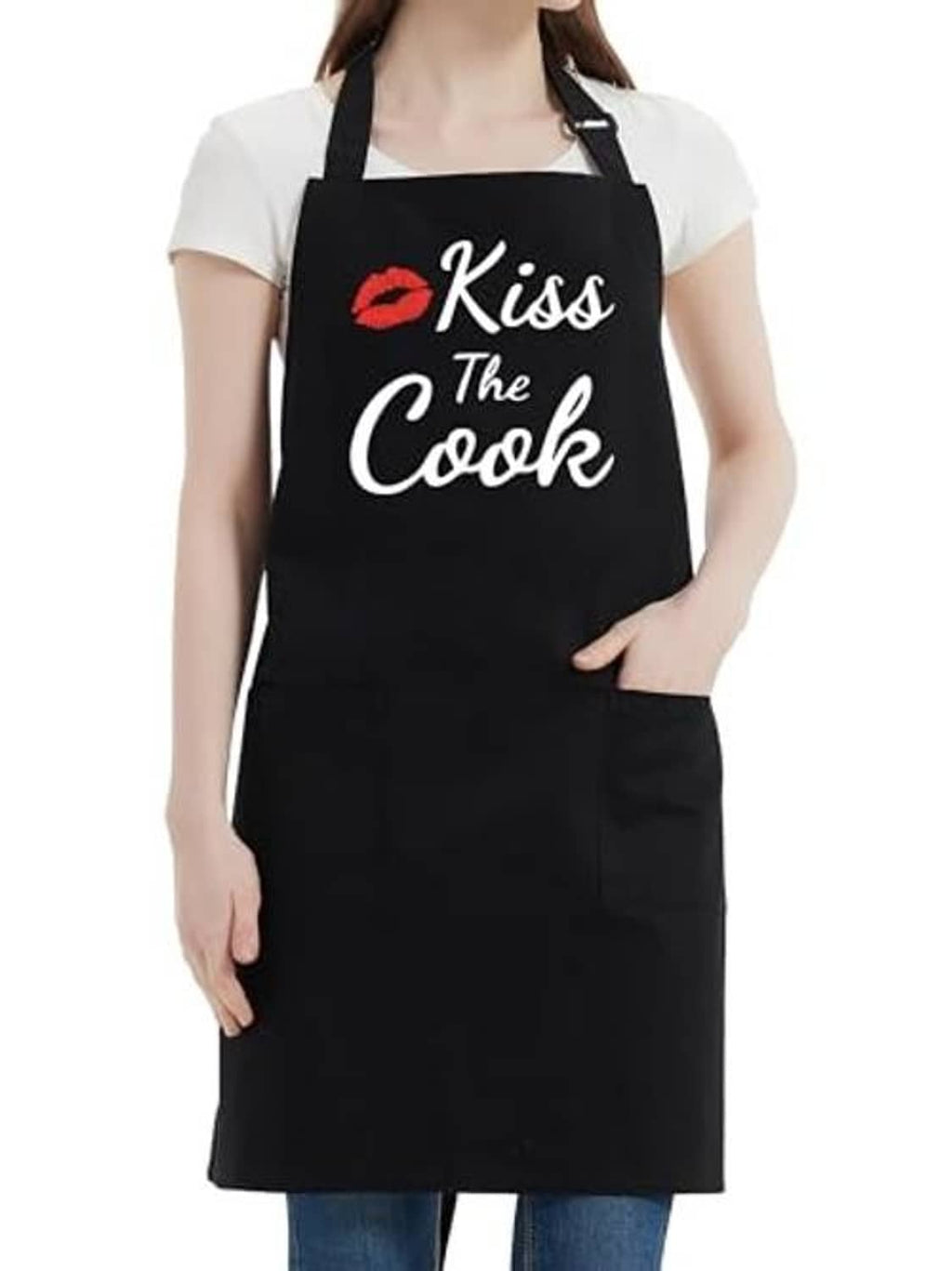 Black apron worn by a person with “Kiss the Cook” logo and front pocket