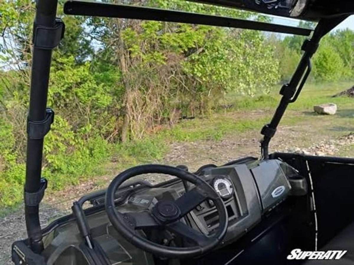 Interior view showing windshield support posts and clear windshield frame on UTV