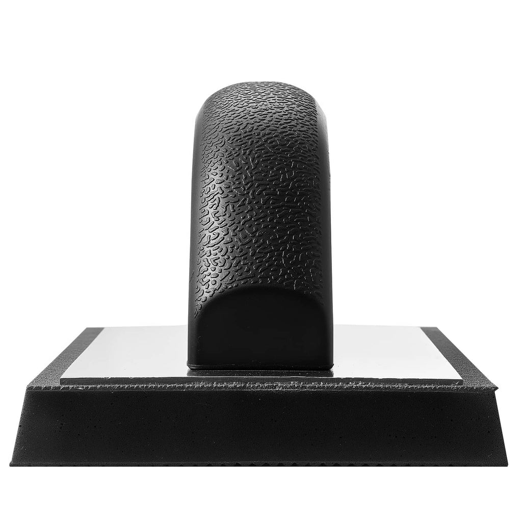 Black grout float with textured handle and flat rectangular rubber base