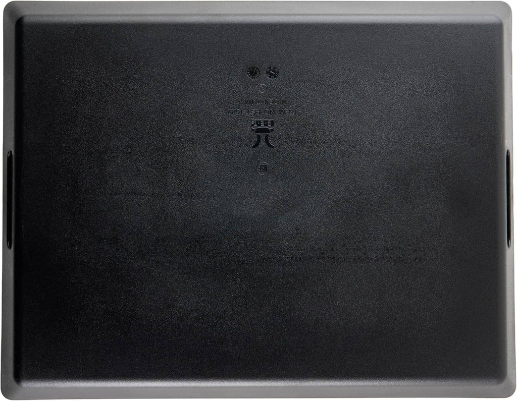 Rectangular black serving tray with two side handle cutouts and flat interior