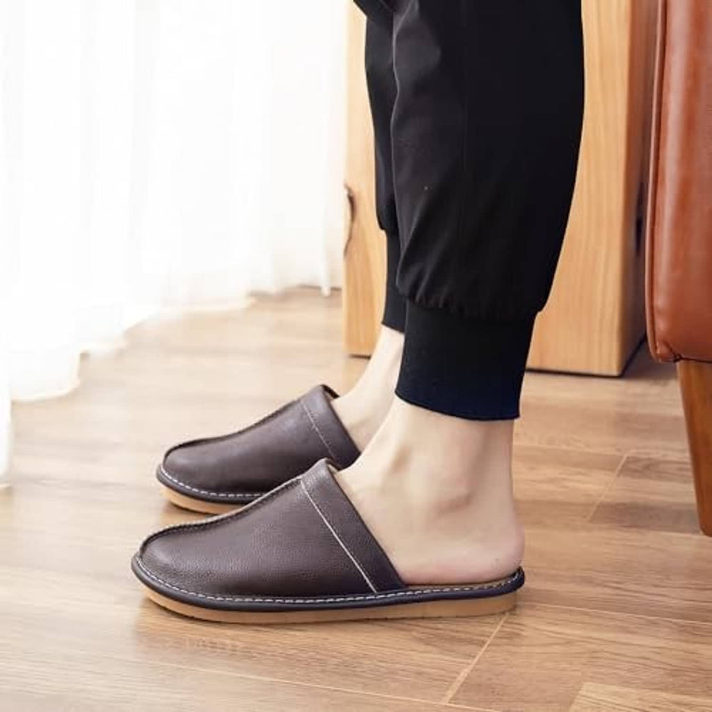 Dark brown leather slip-on slippers with strap opening and stitched rubber sole