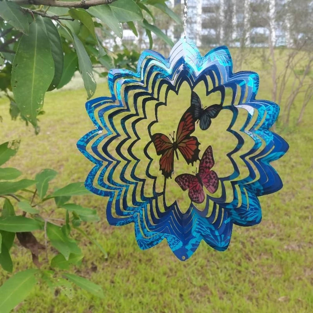 Blue butterfly wind spinner with layered metal petals and hanging chain, outdoor garden style
