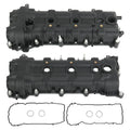 Black valve cover set with gaskets and bolts, showing four intake port openings.
